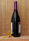 Wine bottle unopened with orchid and bamboo