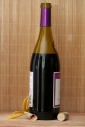 Opened wine bottle with orchid bamboo and cork